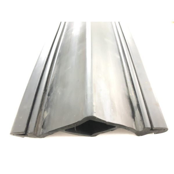 Perforated rubber profile for rail-type expansion joint